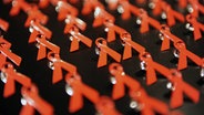   Red ribbons of AIDS © dpa - Bildfunk Photographer: Jens Kalaene 